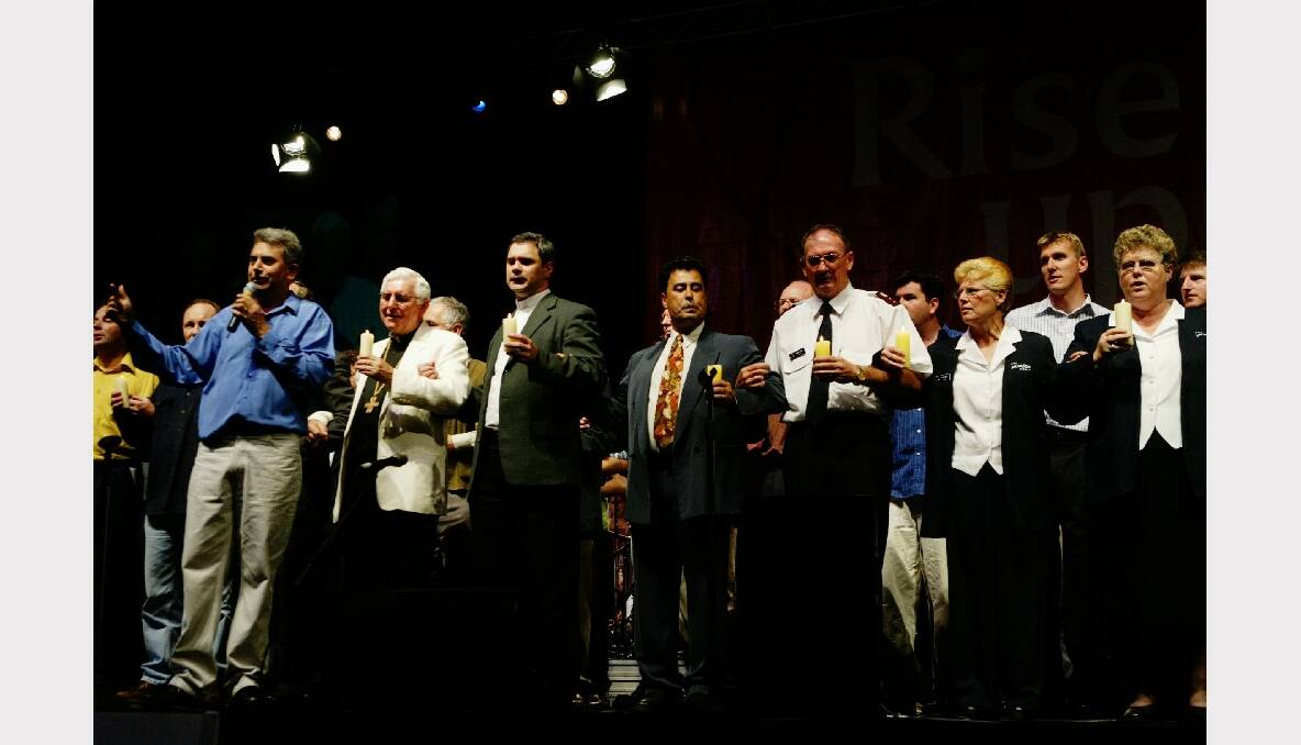 Some of the 80 clergy members representing Christian denominations in the Illawarra on stage at Rise UP. 