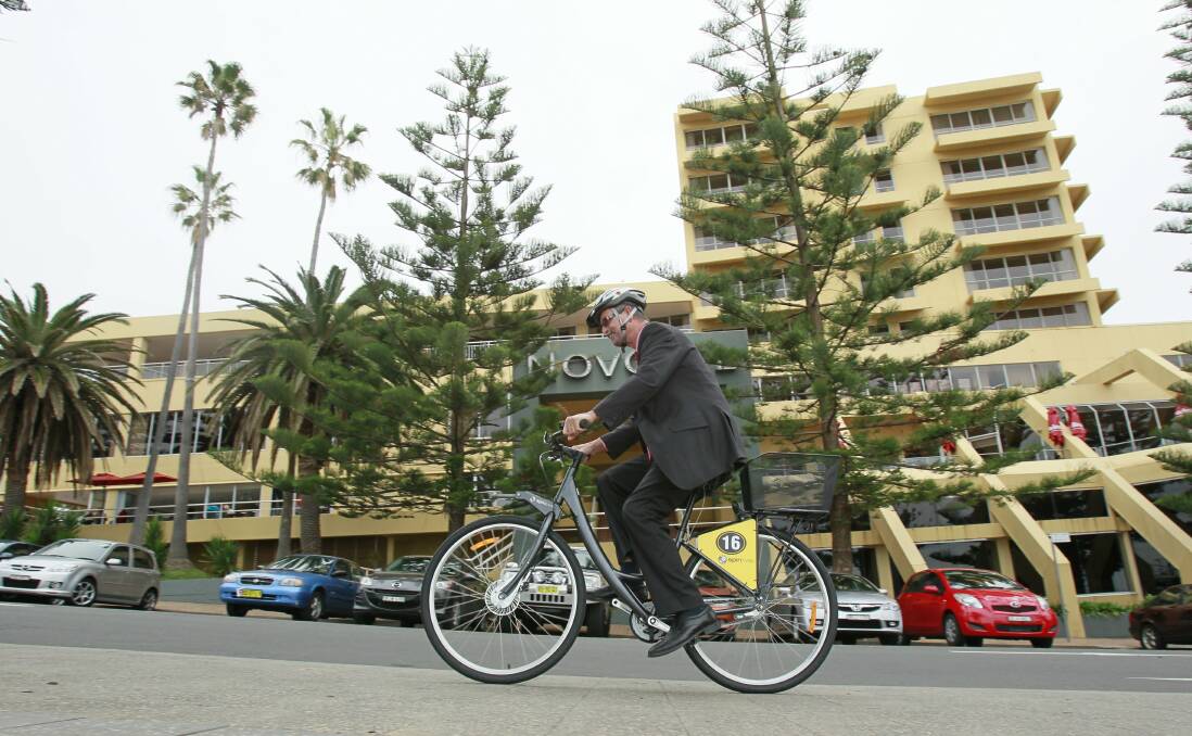 Novotel general manager Walter Imoos on one of the new bikes. Picture: DAVE TEASE
