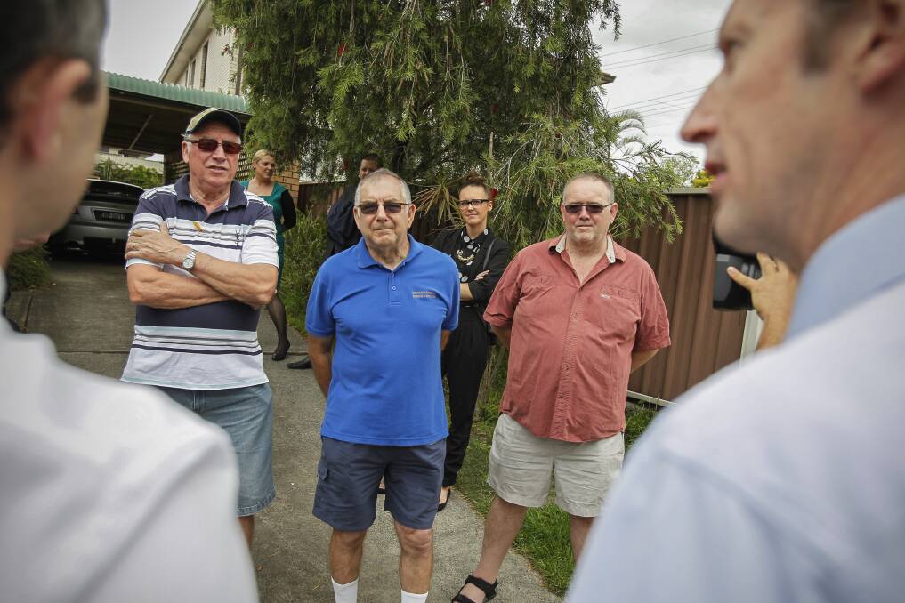 Residents Terry Stretton, Chris Ross and David Kastelein meet to protest about Horsley being cut off from the NBN. Picture: CHRISTOPHER CHAN
