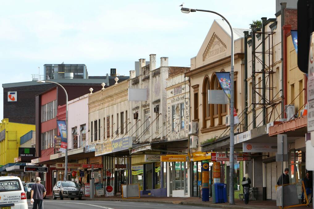 Dowdy-looking shop facades on Crown Street, between Keira and Atchison Streets. Pictures: KIRK GILMOUR, KEN ROBERTSON