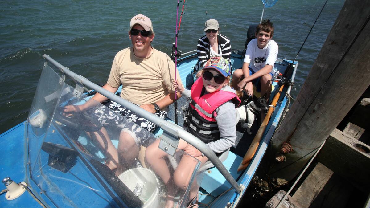 The Thorn family, who are staying at Barrack Point, head out on a fishing expedition on Lake Illawarra. Picture: ROBERT PEET