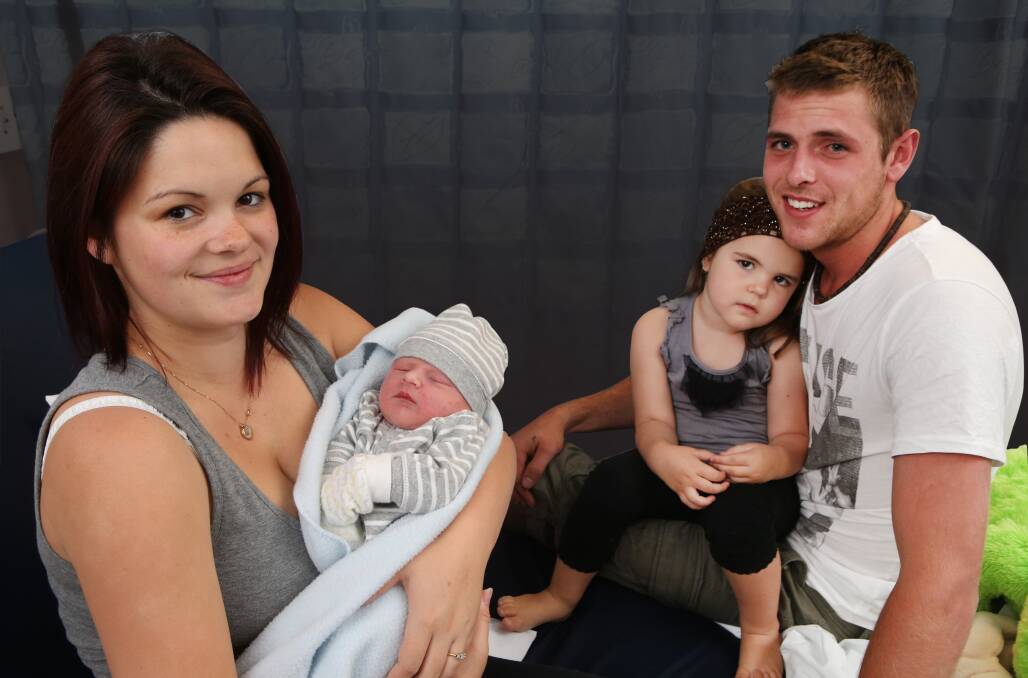 Ellen Leighton with her newborn boy Jaxon Craig, daughter Alliera, 3, and husband Jake Bush. Picture: KIRK GILMOUR