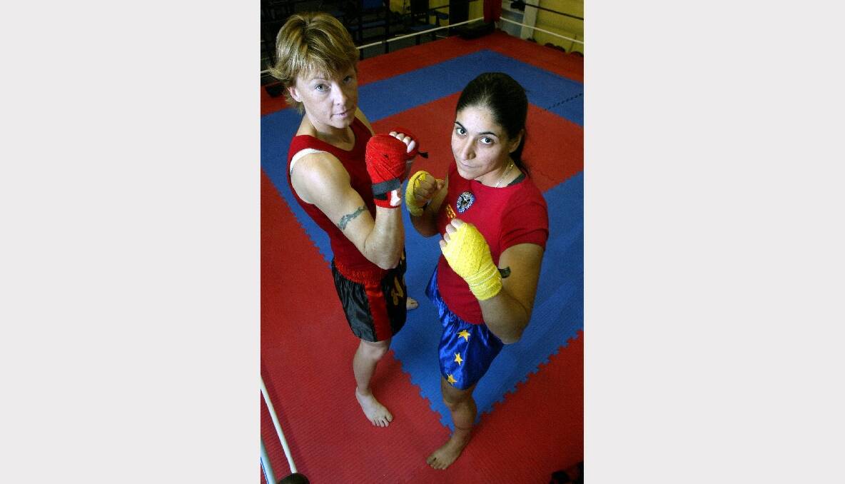 Wollongong kickboxers Tammy Currell (left) and Maria Pittiglio shape up at the Reflex gym in preparation for their title fights in Canberra.