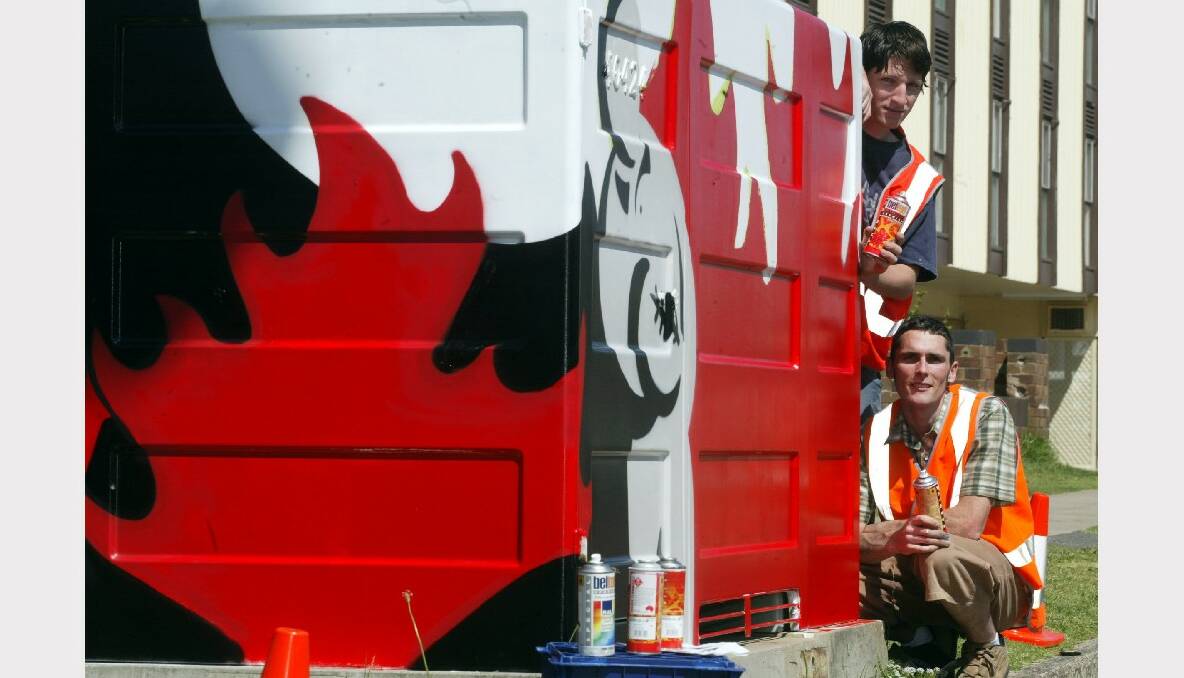 Artists Jarrod Taylor and David Wallin with a decorated Integral Energy boxes in Wollongong.