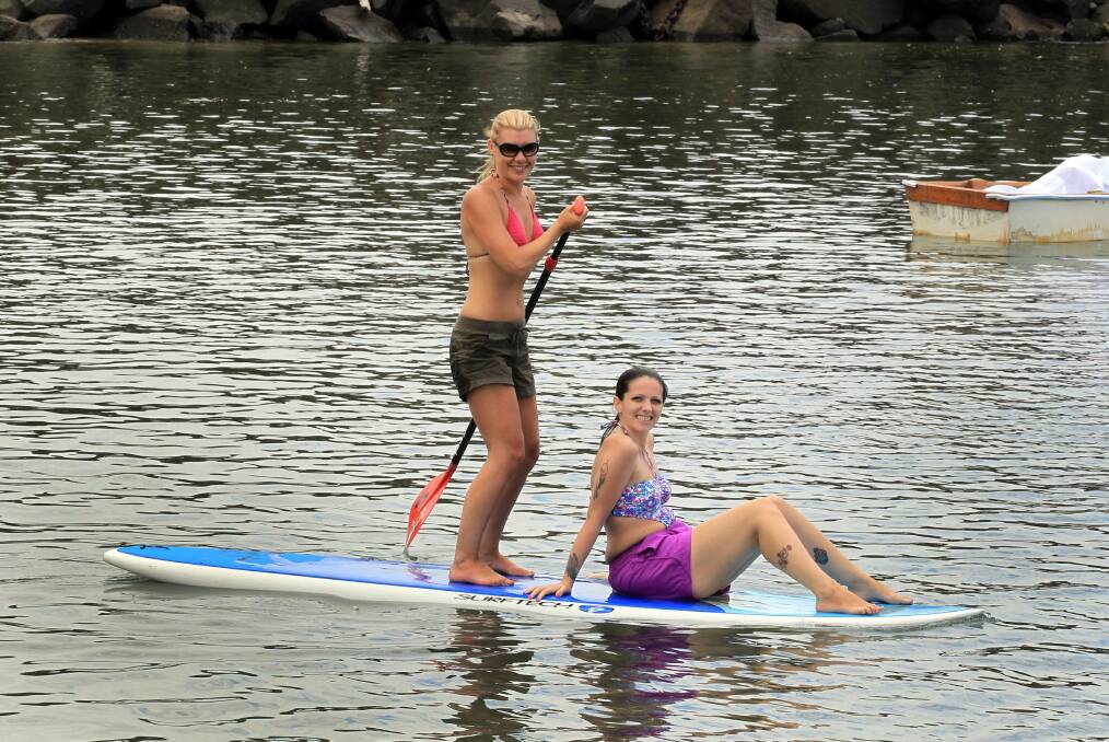 Paddle-boarding in Wollongong Harbour. Picture: ORLANDO CHIODO