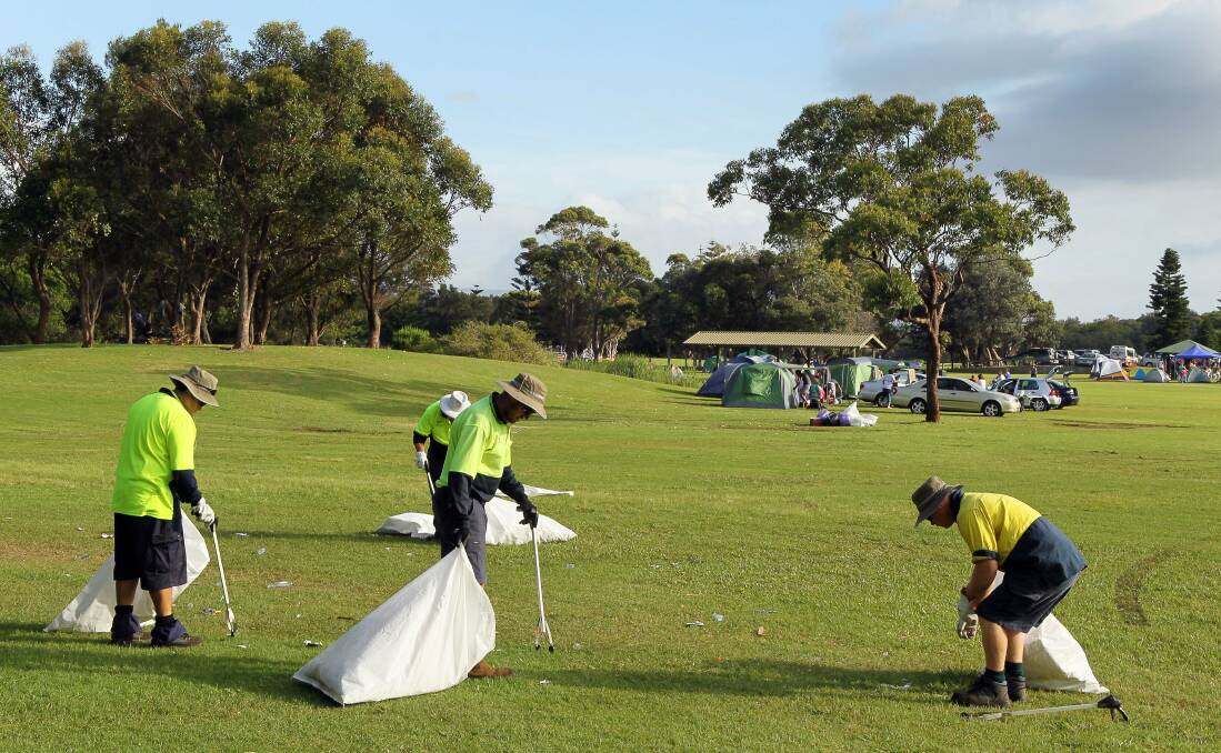 Wollongong City Council staff pick up rubbish at Stuart and Galvin parks. Picture: Kirk Gilmour