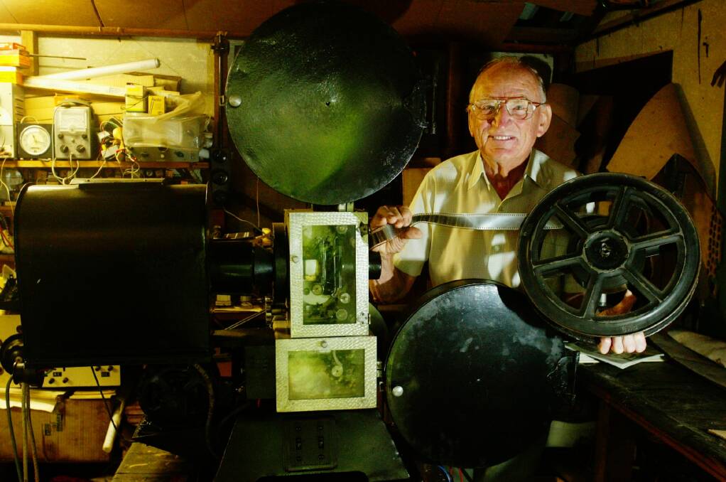 Eddie Vormister of Wollongong with the film projector he made in the 1940s.
