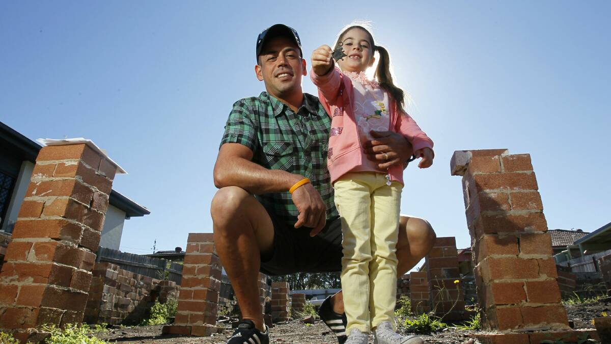 Lani Ornelas and her dad Romeo with the medal awarded to a Wollongong Anzac. Pictures: DAVE TEASE
