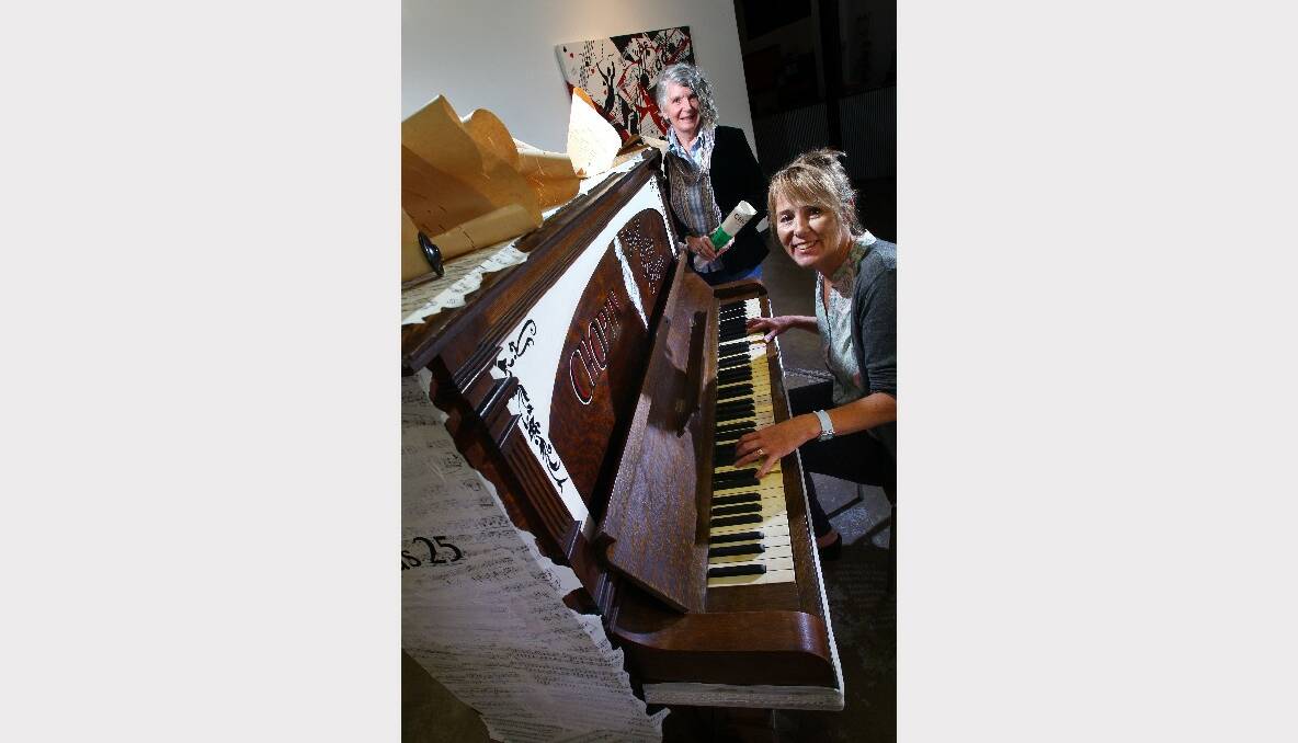 Joni Braham and Cr Vicki Curran with one of the pianos painted for the Illawarra Music Festival. Picture: KEN ROBERTSON