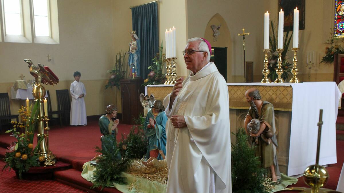 Bishop Peter Ingham conducts Christmas Day mass at St Francis Xavier Cathedral. Picture: GREG TOTMAN