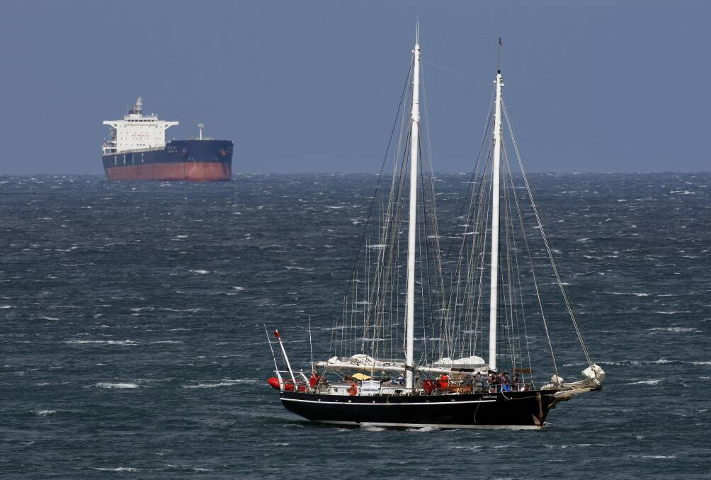 South Passage sails past bulk tankers off North Wollongong after its trip from Darling Harbour. Picture: ANDY ZAKELI