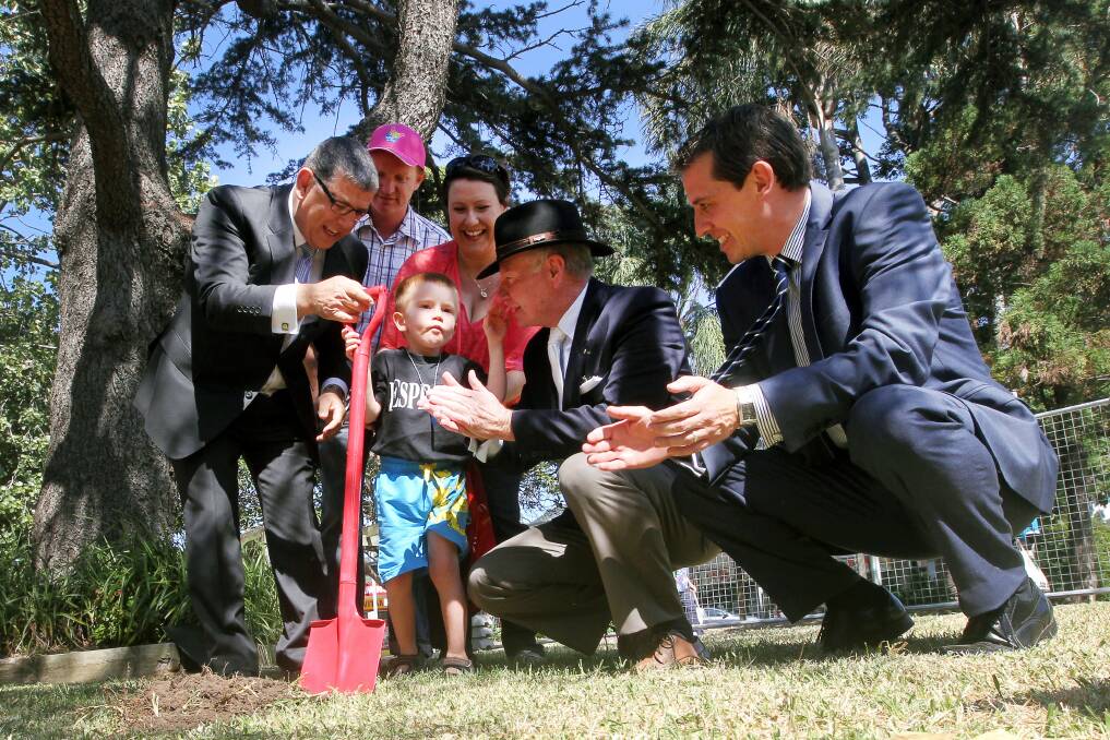 Turning the first sod: The Rapley family with Minister for the Illawarra John Ajaka, Wollongong Lord Mayor Gordon Bradbury and Keira MP Ryan Park. Picture: SYLVIA LIBER