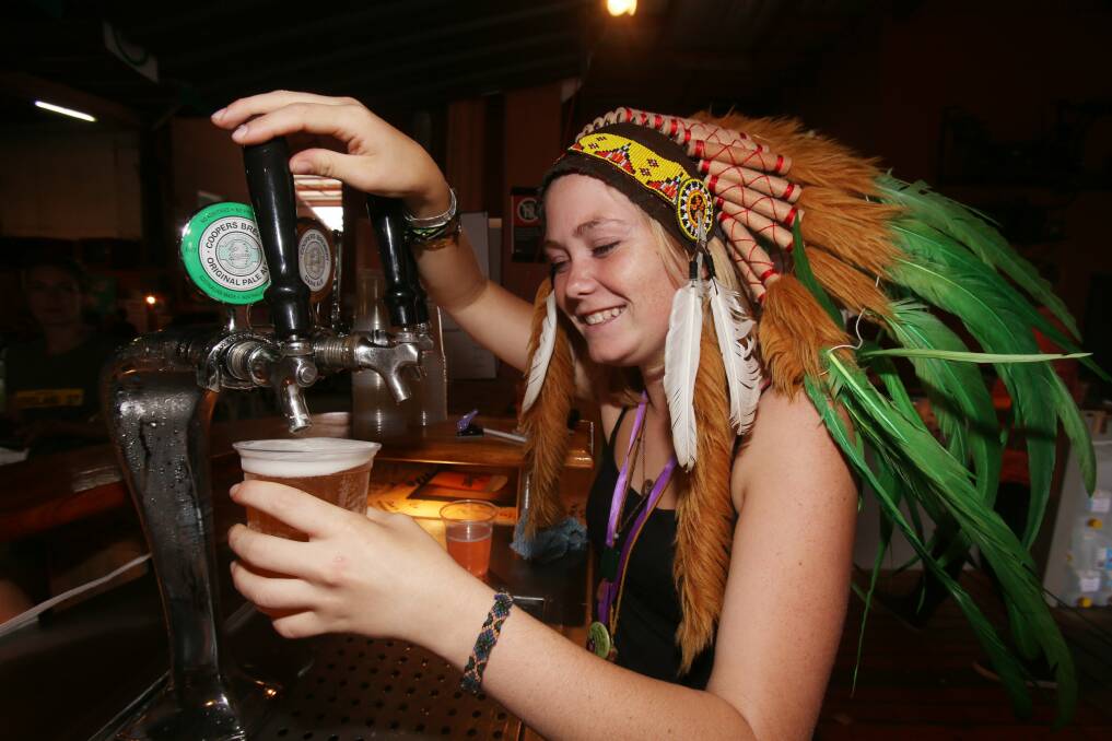 Bec Smeaton pouring a drink at the bar. 