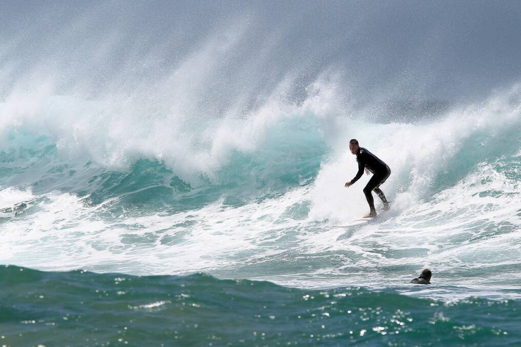 Surfers take advantage of big swell at The Farm. Picture: SYLVIA LIBER