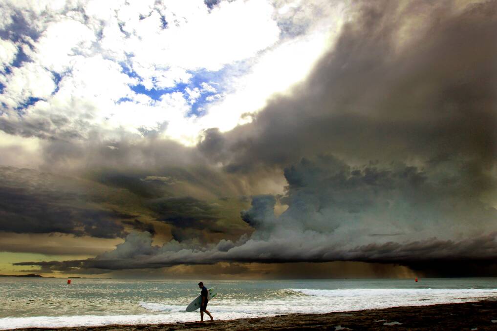 Surfer Daniel Brilsky takes to the surf in Shellharbour on April 7. Picture: SYLVIA LIBER