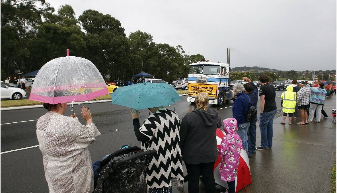  Crowds gather along Lake Entrance Road to watch the 2013 i98FM Camp Quality Convoy for Kids. Picture: ANDY ZAKELI