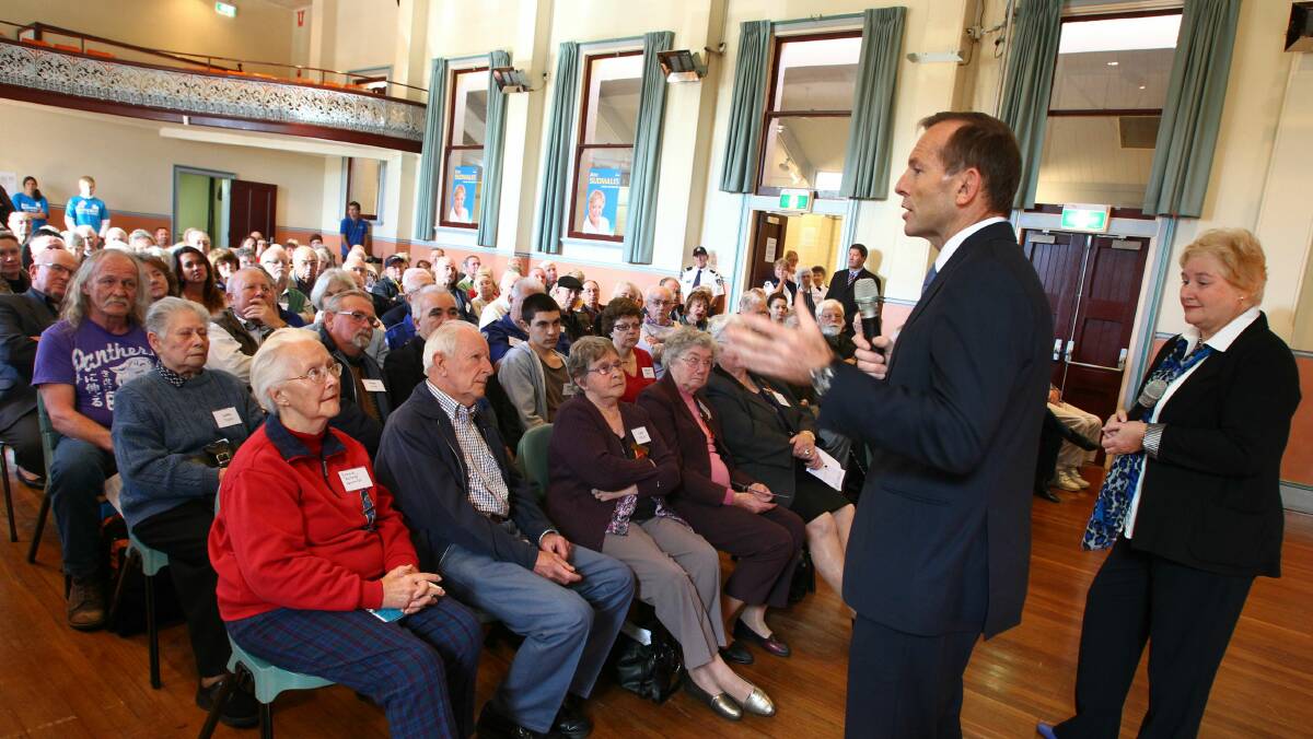 An attentive crowd listens to Mr Abbott reiterate his election promises. 
