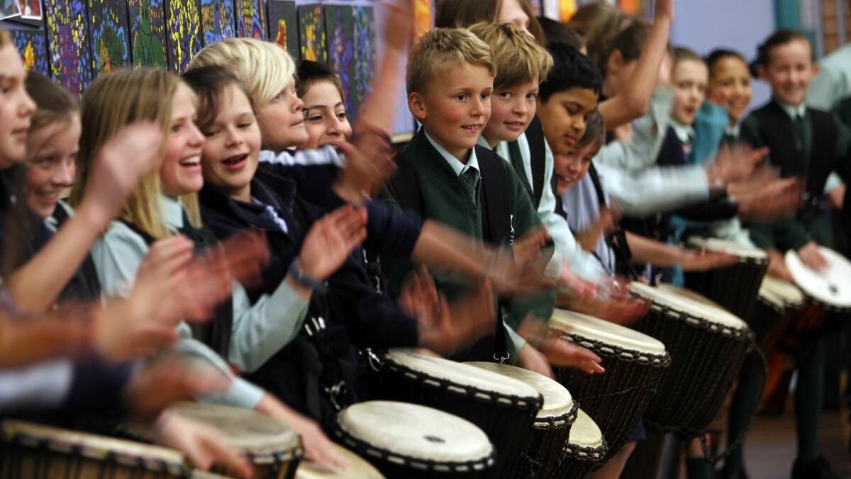Bailey, 10 (centre) joins the drumming chorus at a multi-school African drumming rehearsal this week. Pictures: ANDY ZAKELI