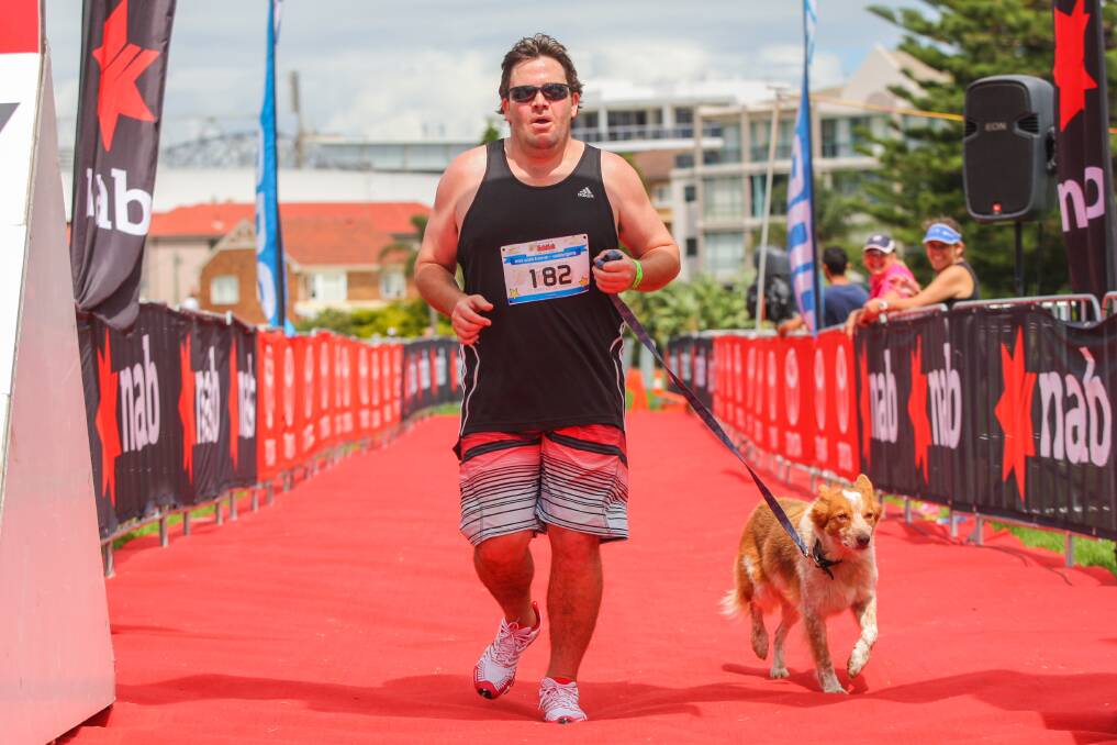 Mick Kelly, of the Hunter Valley, and his dog Lenny take part in the Trithegong KidzWish Fun Run at Wollongong. Picture: ADAM McLEAN