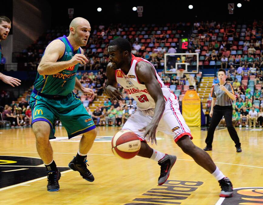 Kevin Tiggs of the Hawks looks to drive past Steven Markovic of the Crocodiles. Picture: GETTY IMAGES
