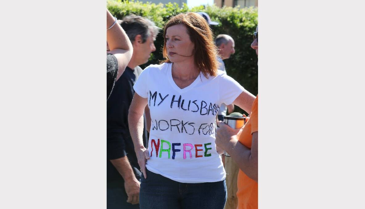 A woman wears a T-shirt emblazoned with the slogan ‘‘My husband works for NR-free’’. 