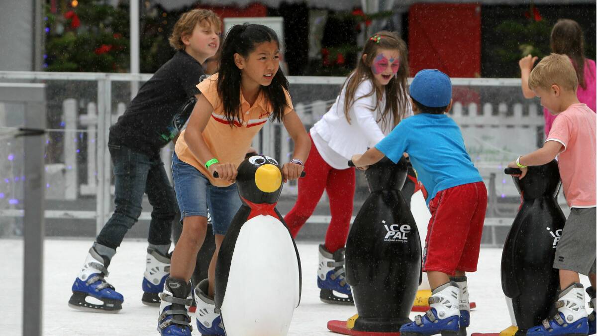 Youngsters take to the temporary ice rink in Wollongong. Picture: GREG TOTMAN