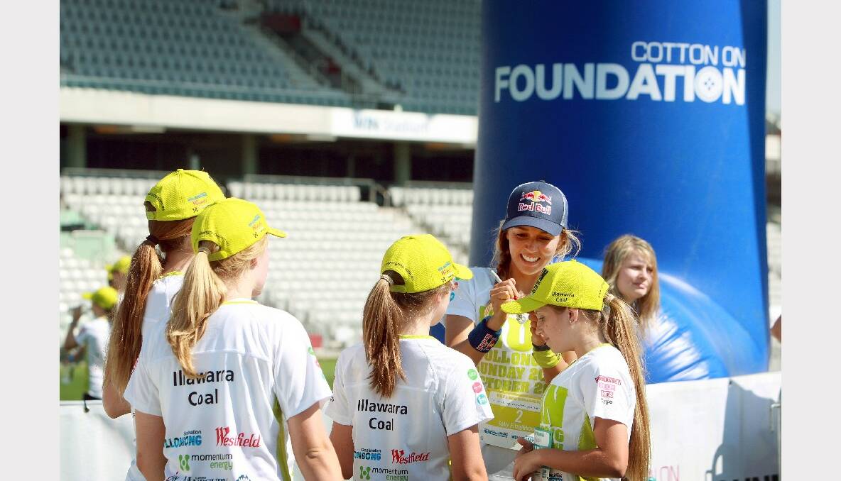 Sally Fitzgibbons signs autographs for fans. Picture: SYLVIA LIBER