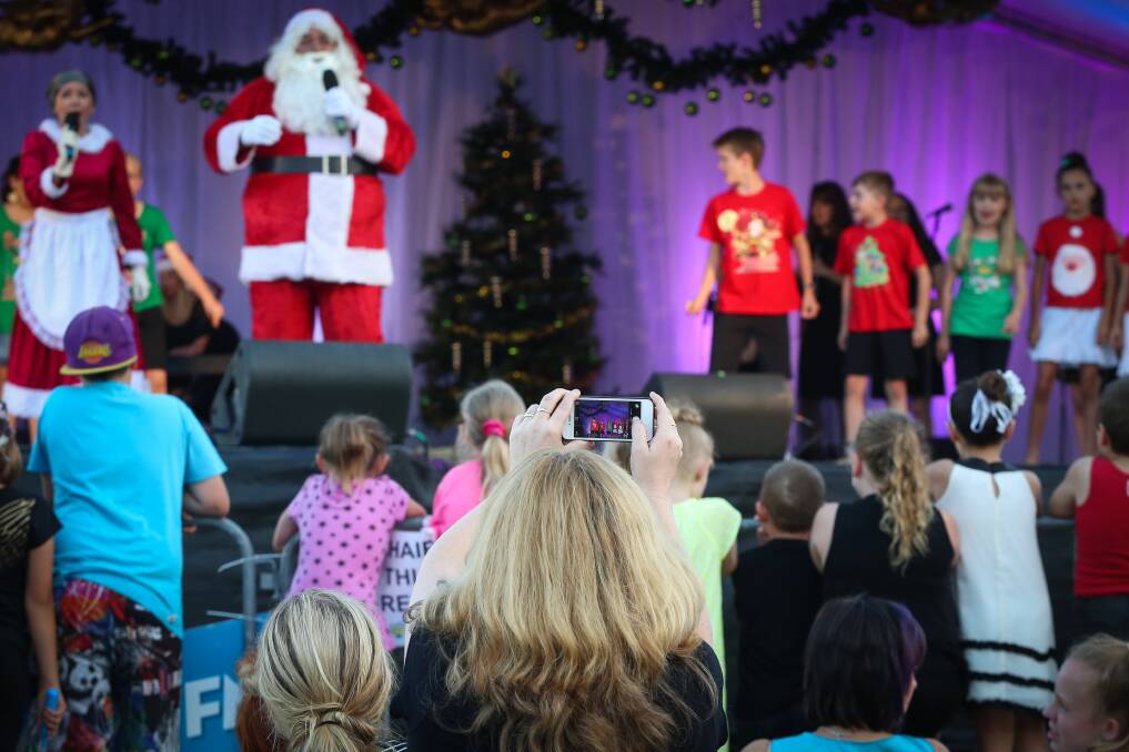Santa on stage at Reddall Reserve. Picture: ADAM McLEAN