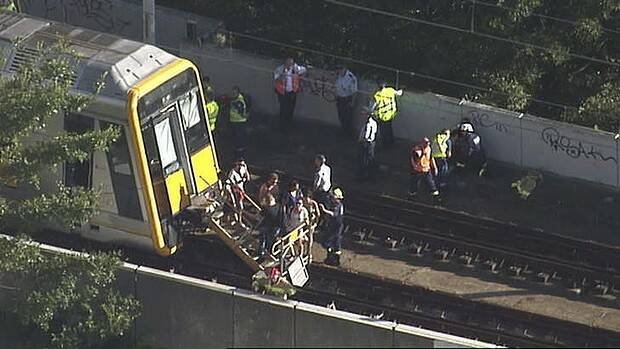 Passengers evacuate the derailed train. Picture: Seven News