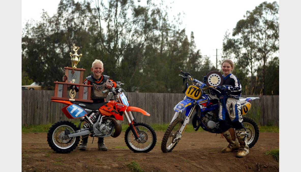 Josh Gilbert (left), who finished third at the Australian Junior National Motor X Championships in South Australia, with Tori Dare, who won six races at a Sydney women's event.