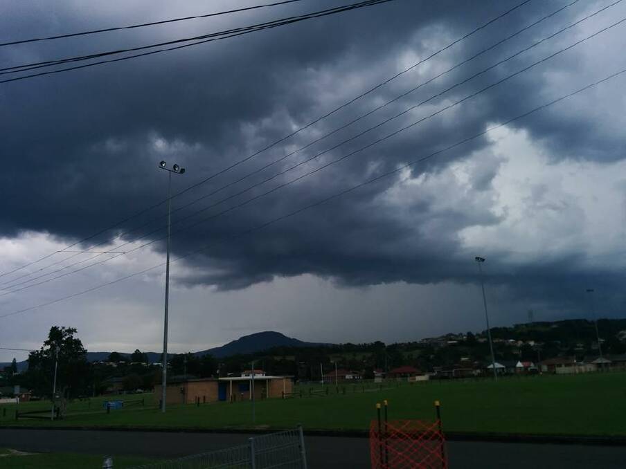 Start of the storm over Mt Kembla. Picture: CHRIS WEBB