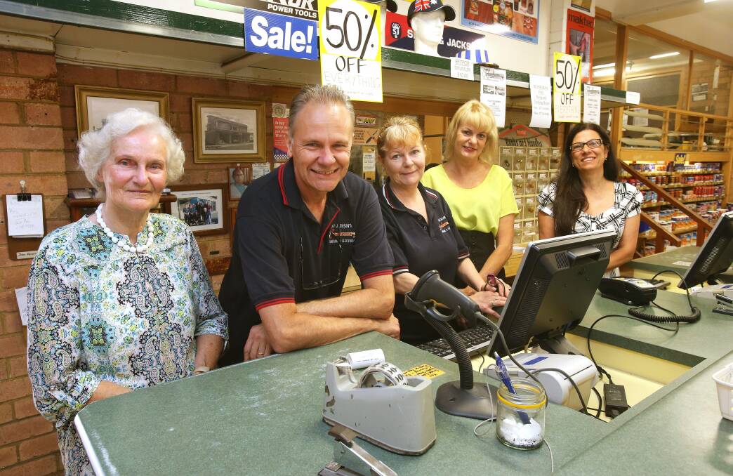  Pam Jansen with her children Ron and Kay Farrington, Lee James and her daughter-in-law and Ron’s wife Rita in the hardware store. Picture: KIRK GILMOUR
