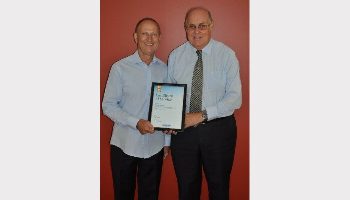 Employee of 40 years Bill Brandon is acknowledged by Greater Building Society chief executive Don Magin.