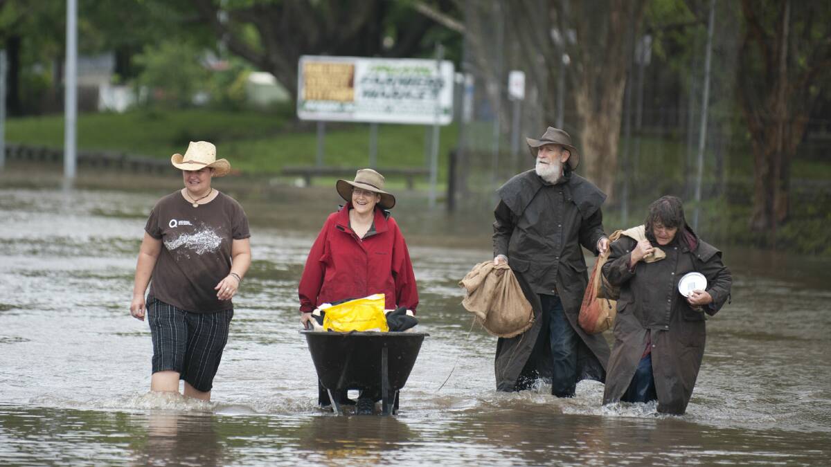 People rescue chickens and other items from the Northey Street Farm in Brisbane. Picture:HARRISON SARAGOSSI