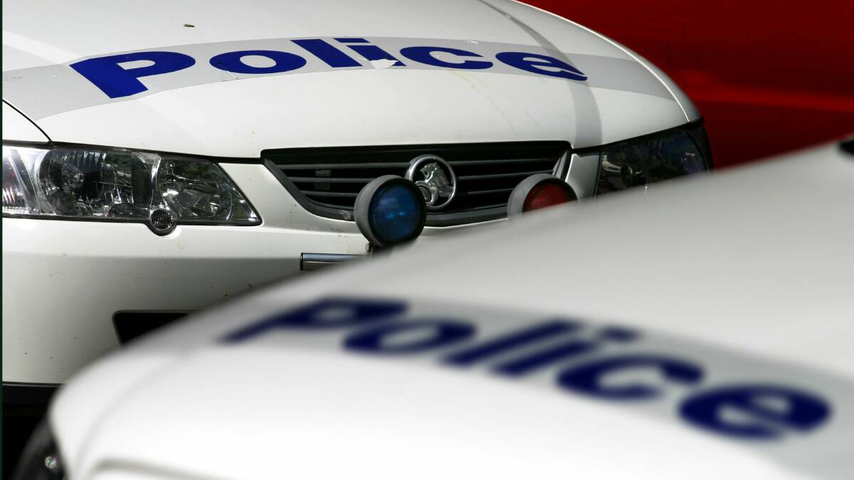 Police are hunting for two men who held up a Koonawarra liquor store on Monday night.