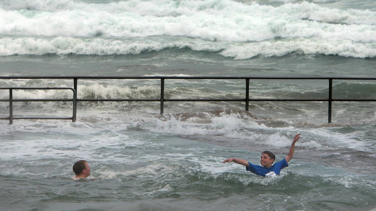 Dylan and Joshua Best from Baulkham Hills go for a swim in the Towradgi ocean pool. Picture: KEN ROBERTSON