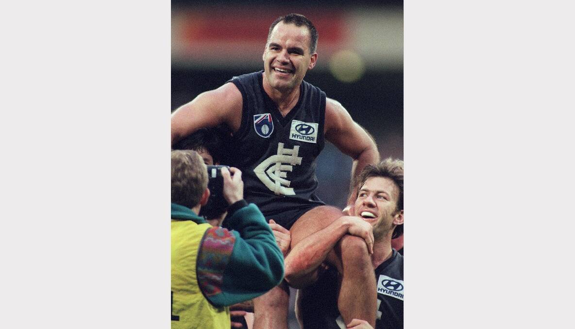 Former AFL star Greg Williams in his playing days. Now suffering a degenerative brain disease, he says AFL players who get concussed should be forced to sit out for two months.