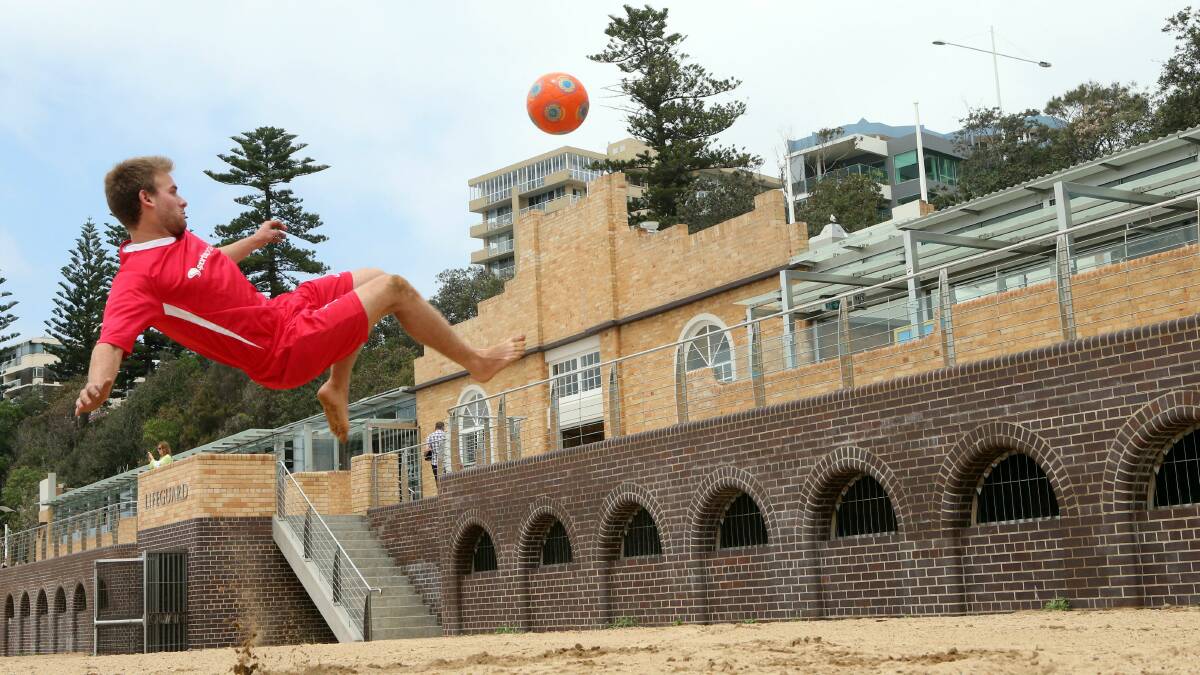  Chris Nathaniel, 21, limbers up for action before the Australian Beach Soccer Cup which starts at North Wollongong beach today. Picture: KIRK GILMOUR
