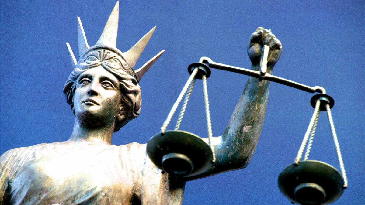 A man faced court charged with assault over an allegedly stolen library card.