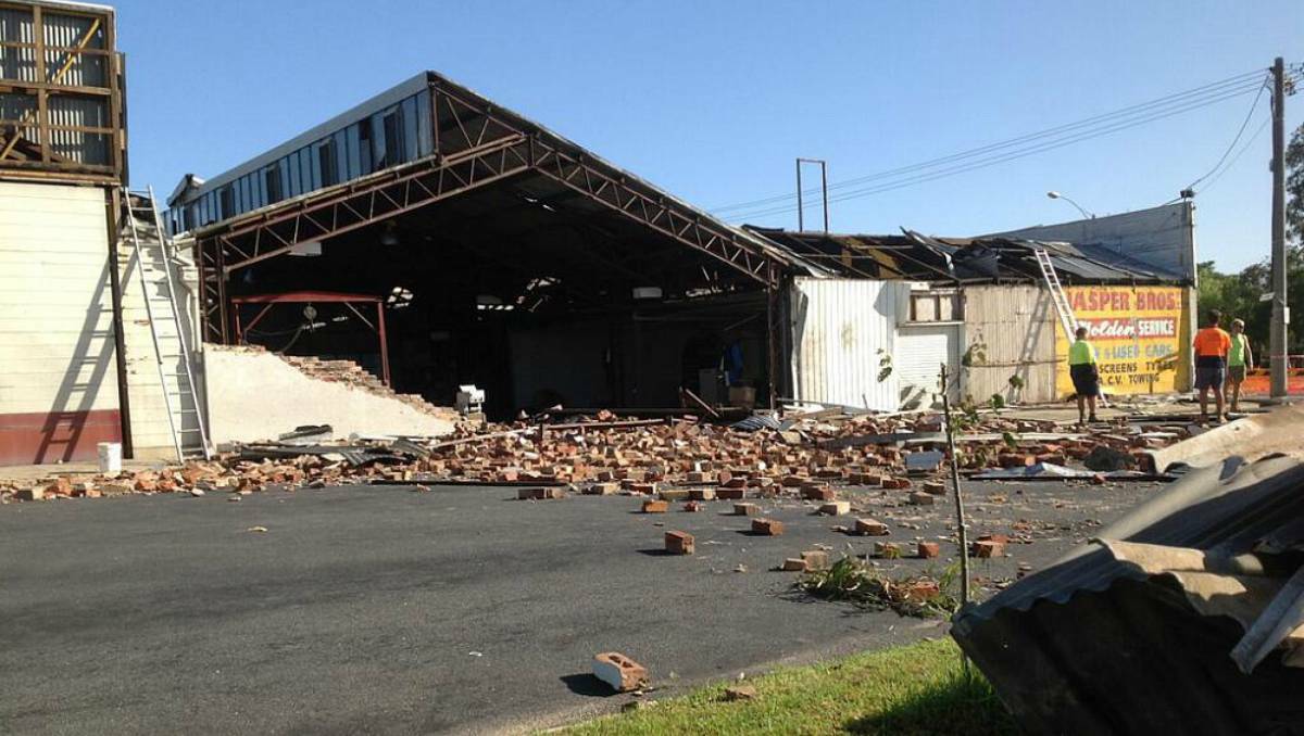 The Jasper Brothers car dealership is barely recognisable after a wall was completely torn away.