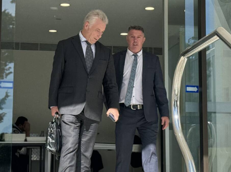 Stephen Newton (right) leaving Wollongong courthouse alongside his lawyer on Monday. Picture ACM
