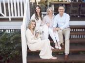 Ariarne, her younger sister Mia and parents Steve and Robyn at the family home they are now selling. Pic: Peter Brew-Bevan/Australian Women's Weekly