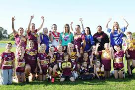 Shellharbour Sharks open women's tackle team manager Emma Kissell (centre light blue top)with others in the Group Seven rugby league community supporting the inaugural Charity Shield fixture for Bravehearts. Picture by Sylvia Liber