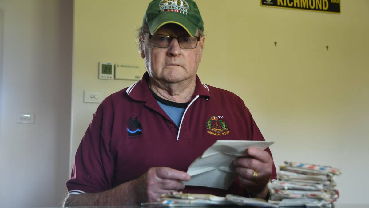 HOME: John Finn reading over the letters he sent to his mother while deployed in Vietnam. Picture: ALEX DALZIEL