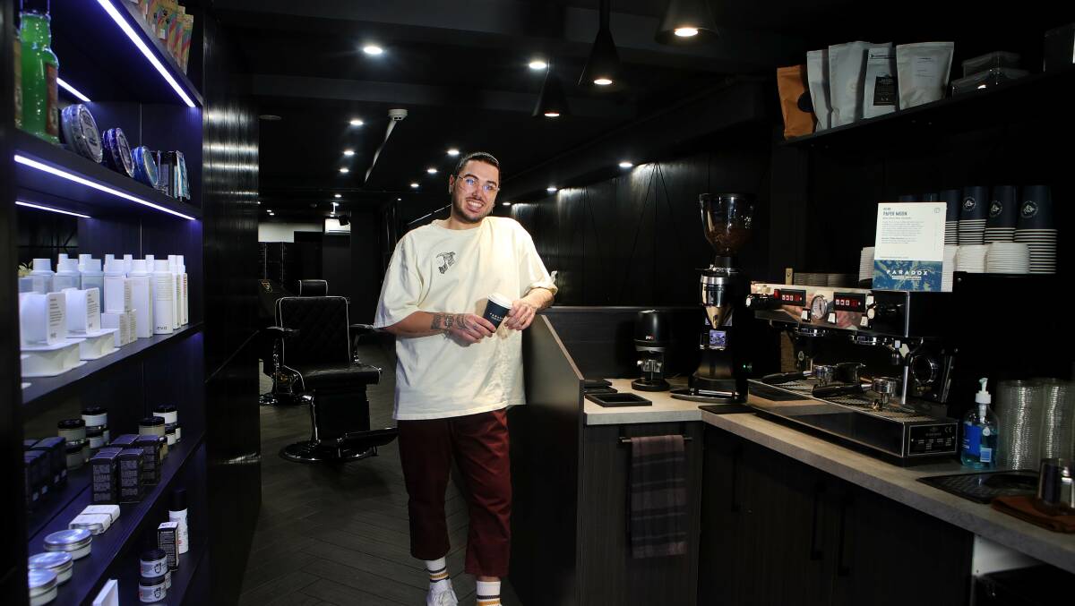 New concept: Braden Mammone at the newly opened Essentials Barbershop and Cafe. Picture: Sylvia Liber