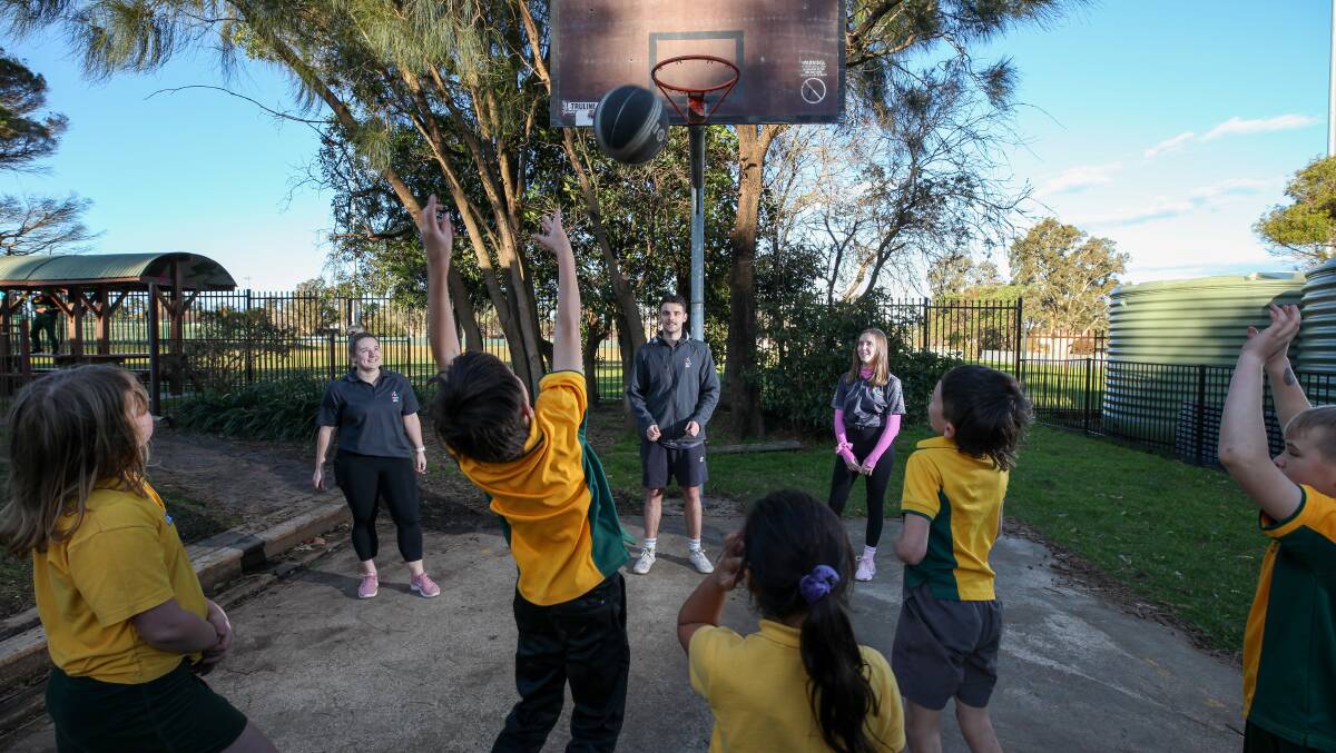Volunteers: Stephanie Lord, Eamon Flint-Peterson and Ebeney Whillas from Healthy Cities Illawarra conducting the Active Inbetweens program with kids at Bellambi Neighbourhood Centre. Picture: Adam McLean