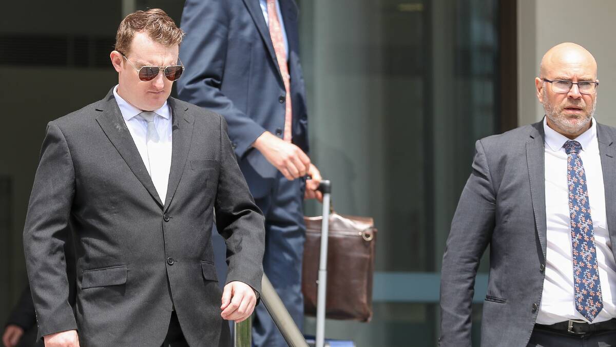 Stephen Fenn leaves Wollongong courthouse with lawyer Patrick Schmidt. Picture by ACM