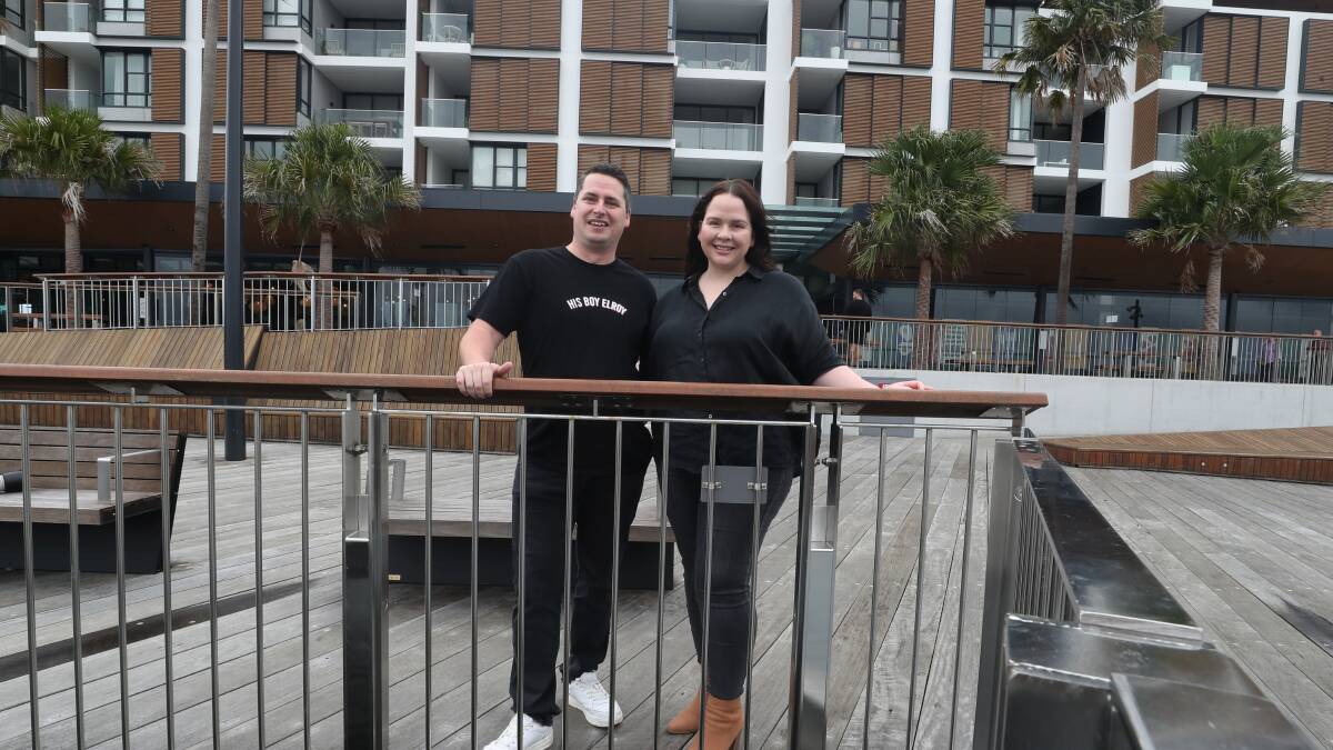 New digs: Lachlan Stevens and Selena Stevens outside the future site of His Boy Elroy Shell Cove. Picture: Robert Peet