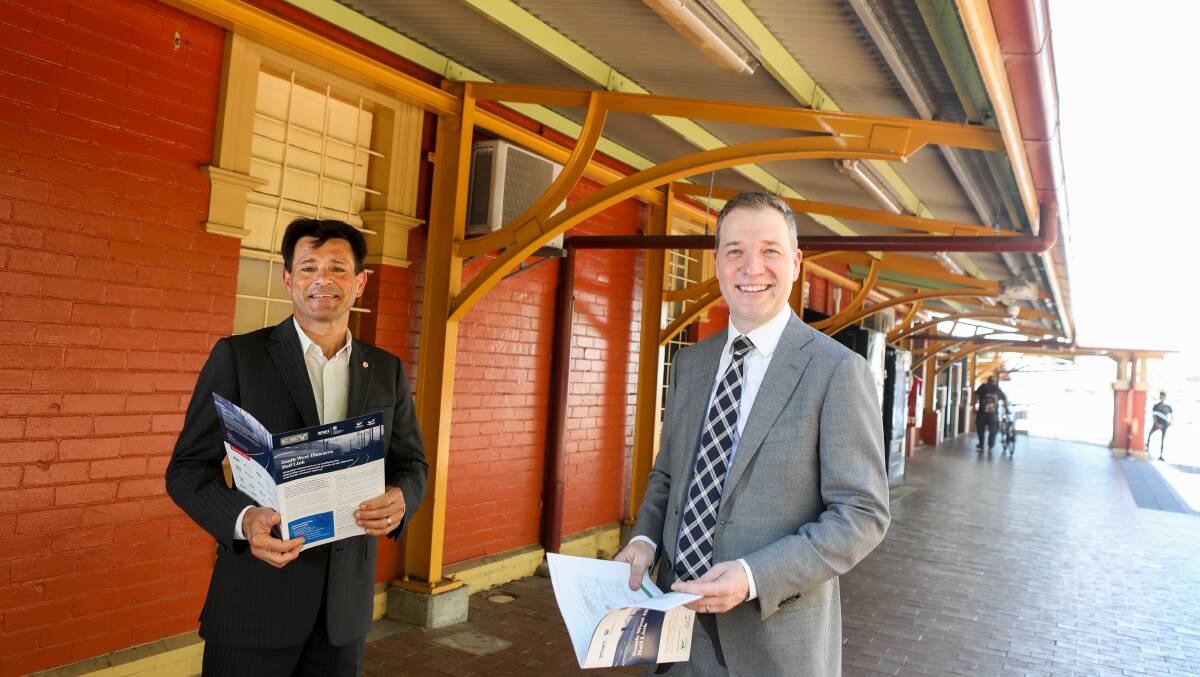Adam Zarth (right) with UOW professor Pascal Perez at a launch of a report advocating for a rail link between the Illawarra and southwest Sydney. Picture by Adam McLean 