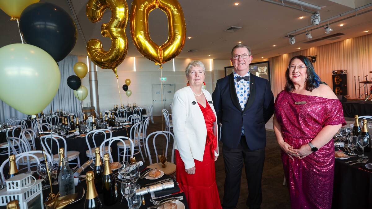 UOW Dean of Business Grace McCarthy, current The Illawarra Connection president Graham Lancaster and vice president Yvonne Walker celebrate the group's 30th anniversary. Picture by Adam McLean